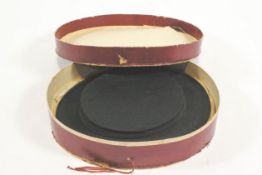 A collapsible top hat, in original box by Foster Bros Hatters,