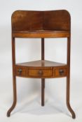 A 19th century mahogany corner wash stand, with raised back above a bowl recess,