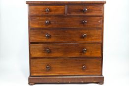 A Victorian mahogany chest of drawers, with two narrow drawers above four wide graduated drawers,