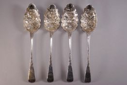 A group of four silver Old English pattern berry spoons,