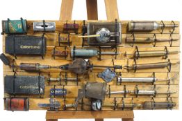Automobilia - a display board of assorted oil cans and lubrication devices,