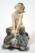 A Royal Copenhagen porcelain figure (No.858) of a satyr riding a tortoise,