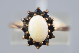 A yellow metal cluster ring.
