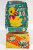 A boxed clockwork Japanese elephant and "A quacking duck",