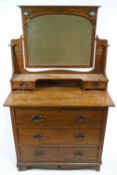 An Arts and Crafts style oak dressing table and mirror,
