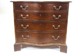 A George III style mahogany chest of four serpentine fronted drawers,