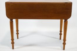 A 19th century mahogany Pembroke table with frieze drawer raised on turned legs,