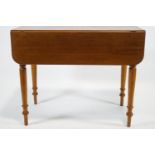 A 19th century mahogany Pembroke table with frieze drawer raised on turned legs,