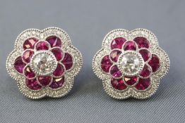 A pair of white metal cluster stud earrings.