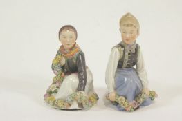 A pair of Royal Copenhagen Amager figures, printed and painted marks, number 12414,