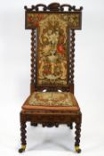 A Victorian mahogany framed nursing chair, with carved scroll crest,
