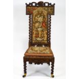 A Victorian mahogany framed nursing chair, with carved scroll crest,