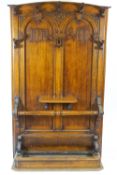 A Victorian oak hall stand, the Gothic panelled back with HR VII,