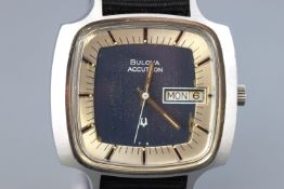 A Bulova Accutron wristwatch. Silver/Blue dial with baton markings and day/date feature.