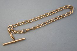 A yellow metal open linked watch chain with fitted Tbar and swivel clasp.