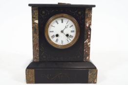 A Victorian slate and marble mantel clock, with white enamel dial enclosing an eight day movement,