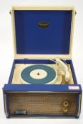 A Dansette Troubadour table top record player with cream and blue case enclosing the turn table