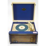 A Dansette Troubadour table top record player with cream and blue case enclosing the turn table