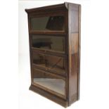 An oak Globe Wernicke style four tier bookcase,