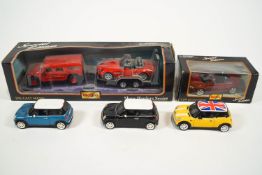 A boxed Maisto 1:27 Hummer, a 1:24 BMW on trailer,