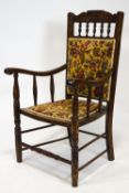 An Edwardian mahogany framed armchair, with upholstered back and seat,