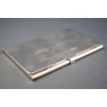 A Tiffany & Co plain rectangular form silver card case with flip top lid, 6cm x 9 cm,