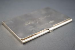 A Tiffany & Co plain rectangular form silver card case with flip top lid, 6cm x 9 cm,