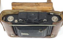 A Zeiss lkon super lkonta folding camera, with Carl Zeiss Jenna lens Nr 1523458, Triostar 1:4,