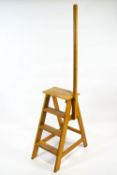 A beech three step library ladder with support pole 179cm high x 41cm wide x 68cm deep