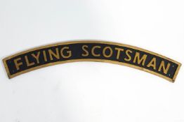 A brass Flying Scotsman train style nameplate,