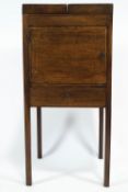 A George III mahogany washstand cupboard of rectangular form with hinged double fold top