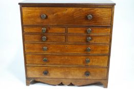 A 19th century mahogany secretaire with drop front secretaire drawer above four short drawers