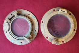 A pair of brass miniature portholes,