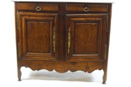 An 18th century French oak side cupboard, probably Breton,