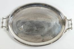 A large silver plate tray, by Alfred Lindley of Sheffield, with central festoon engraving,