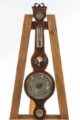 An early 19th century mahogany cased banjo barometer, the silvered dials signed by Ciceri & Pini,