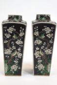 A pair of Chinese porcelain black ground lamp bases, of tapering square section,