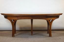 A late 20th/early 21st century oval walnut desk by Touchwood, with central flared support,