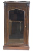 An early 19th century rosewood display cabinet with unusual lancet gallery