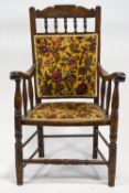 An Edwardian mahogany framed armchair, with upholstered back and seat,