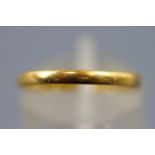 A yellow metal D shaped 2.2mm wedding ring. Hallmarked 22ct gold, Birmingham, 1946.