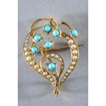 A yellow metal abstract brooch set with seed pearls and turquoise. Untested - stamped 15ct.