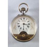 An Etonia open faced manual wind pocket watch with visible escapement to dial.