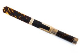 A silver and tortoiseshell page turner mounted in silver, with a handle and flat blade.
