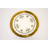 A Burleigh Ware pottery charger decorated in Successionist style within a wide gilt band,