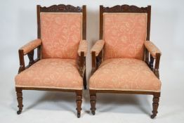 A pair of late Victorian armchairs,