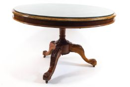 A mahogany round tilt top breakfast table,