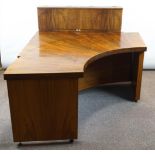 A late 20th/early 21st century walnut veneered corner desk by Ben Brooks,