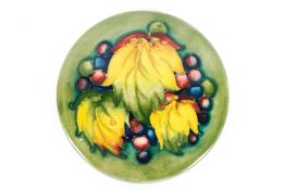 A Moorcroft 'Leaf & Berries' pattern, green ground powder bowl and cover, early 20th century,