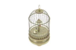 An unusual bird in cage clock, in the form of a 19th century Swiss Automaton,